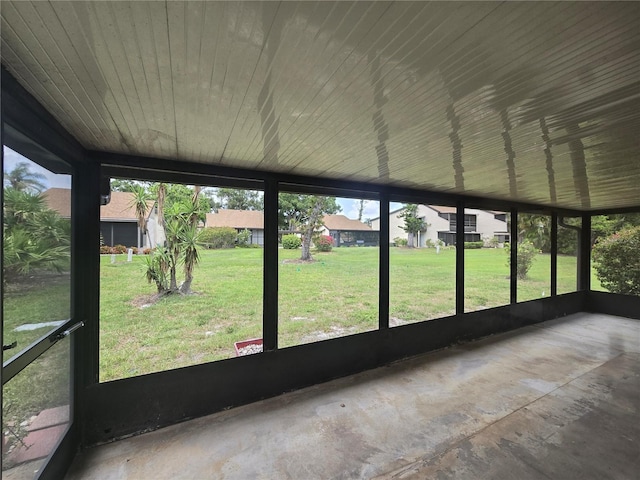624 White Pine Tree Rd Unit 5, Venice, FL 34285 - unfurnished sunroom with a residential view