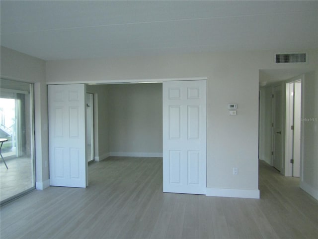 999 Inlet Cir Unit D101, Venice, FL 34285 - unfurnished bedroom with light wood-type flooring and a closet