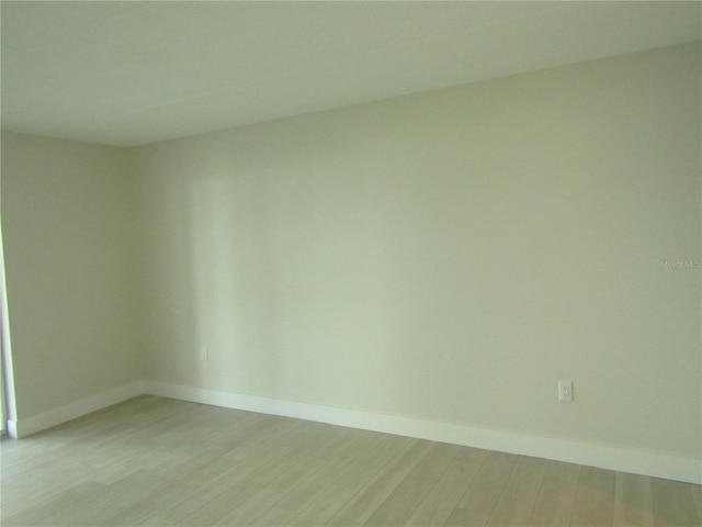 999 Inlet Cir Unit D101, Venice, FL 34285 - empty room featuring light wood-style floors and baseboards