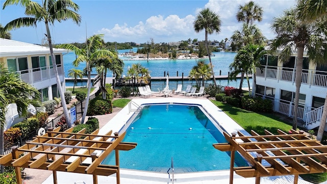 999 Inlet Cir Unit D101, Venice, FL 34285 - community pool featuring a water view, a patio area, and a pergola