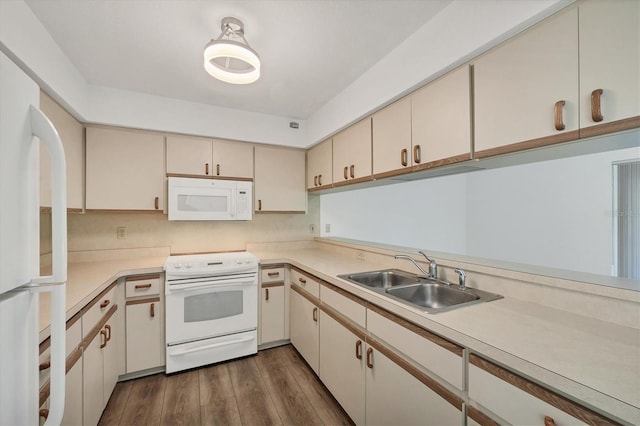 1614 Quail Lake Dr, Venice, FL 34293 - kitchen featuring white appliances, cream cabinetry, light countertops, and dark wood-style floors