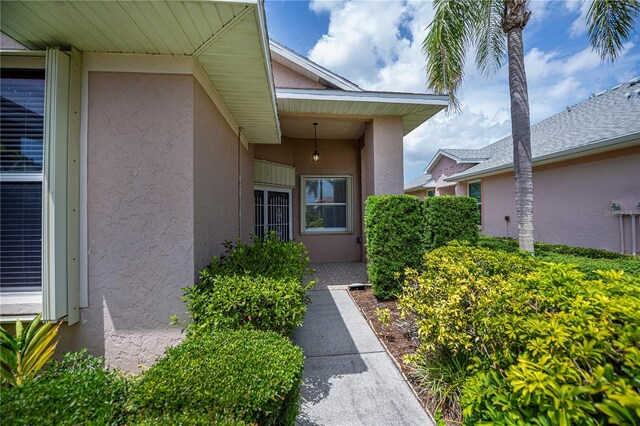 519 Catalina Isles Cir, Venice, FL 34292 - view of exterior entry featuring stucco siding