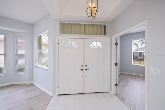 519 Catalina Isles Cir, Venice, FL 34292 - foyer with light wood finished floors and a chandelier