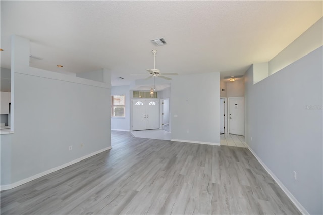 519 Catalina Isles Cir, Venice, FL 34292 - unfurnished living room featuring ceiling fan and light wood-type flooring