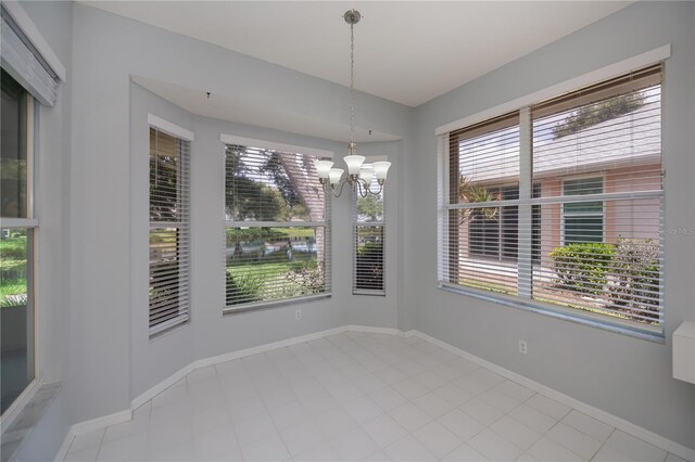 519 Catalina Isles Cir, Venice, FL 34292 - unfurnished dining area featuring plenty of natural light and a chandelier