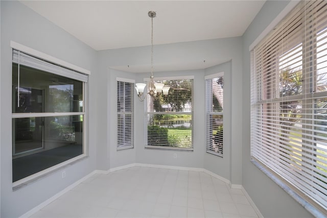 519 Catalina Isles Cir, Venice, FL 34292 - unfurnished dining area with a chandelier and tile patterned floors