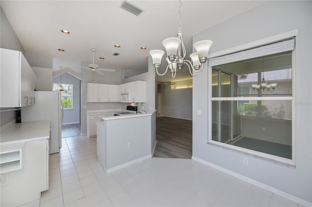 519 Catalina Isles Cir, Venice, FL 34292 - kitchen with a chandelier, white appliances, white cabinets, ceiling fan, and recessed lighting
