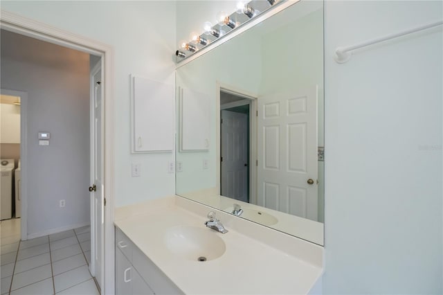 519 Catalina Isles Cir, Venice, FL 34292 - bathroom with tile patterned flooring, independent washer and dryer, and vanity