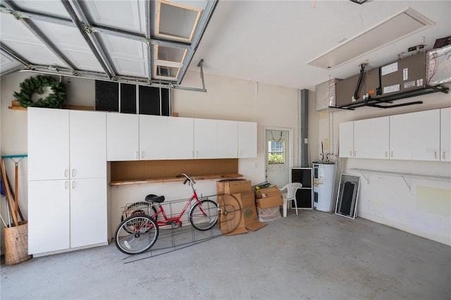 519 Catalina Isles Cir, Venice, FL 34292 - garage featuring electric water heater
