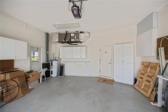 519 Catalina Isles Cir, Venice, FL 34292 - garage featuring water heater and a garage door opener