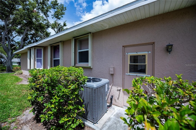 519 Catalina Isles Cir, Venice, FL 34292 - exterior view of stucco siding and a central air condition unit