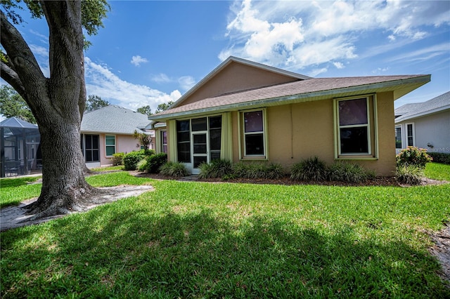 519 Catalina Isles Cir, Venice, FL 34292 - view of front of house featuring stucco siding and a front lawn