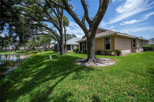 519 Catalina Isles Cir, Venice, FL 34292 - view of grassy yard featuring a water view