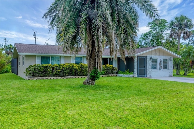 386 Nightingale Rd, Venice, FL 34293 - ranch-style house with a front lawn and board and batten siding