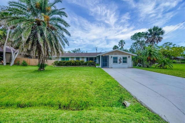 386 Nightingale Rd, Venice, FL 34293 - ranch-style house with driveway and stone siding