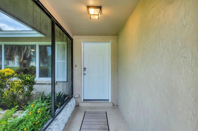 386 Nightingale Rd, Venice, FL 34293 - view of exterior entry featuring stucco siding