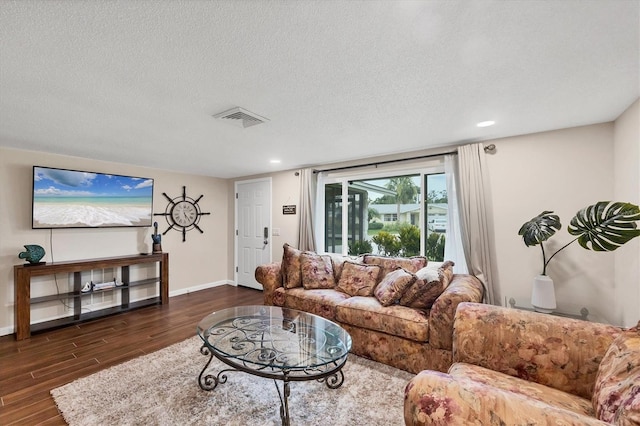 386 Nightingale Rd, Venice, FL 34293 - living area with dark wood-type flooring, recessed lighting, and a textured ceiling