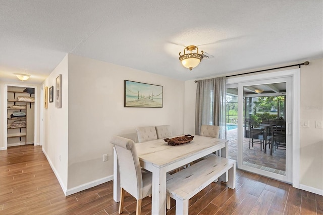 386 Nightingale Rd, Venice, FL 34293 - dining space featuring wood finished floors and a textured ceiling