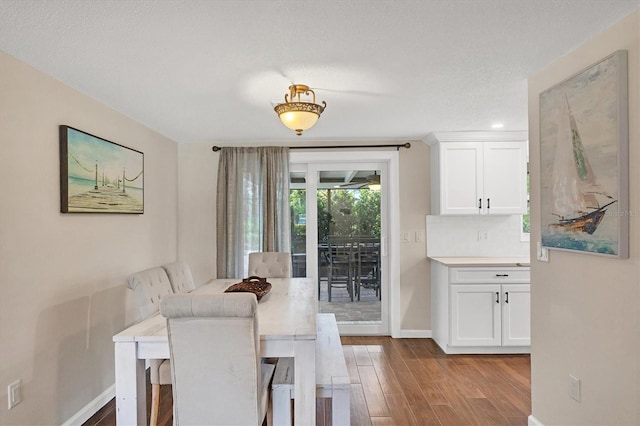 386 Nightingale Rd, Venice, FL 34293 - dining room with wood finished floors and baseboards