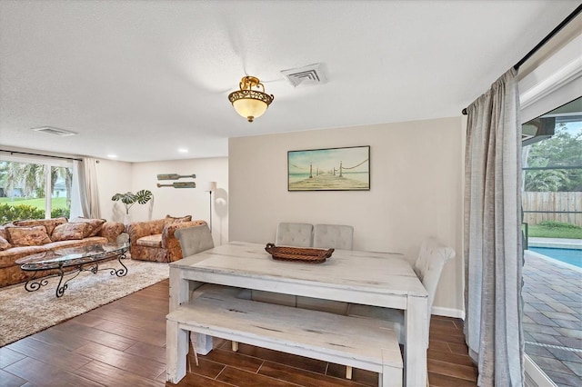 386 Nightingale Rd, Venice, FL 34293 - dining room featuring dark wood-style floors, plenty of natural light, and recessed lighting