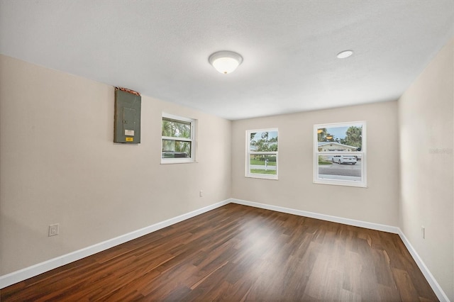 386 Nightingale Rd, Venice, FL 34293 - unfurnished room featuring electric panel and dark wood finished floors