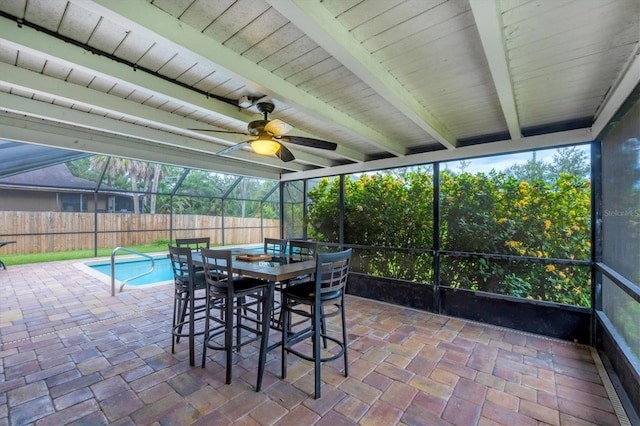 386 Nightingale Rd, Venice, FL 34293 - sunroom with a ceiling fan, beam ceiling, and outdoor dining space