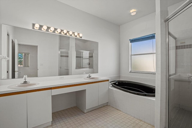 9528 Knightsbridge Cir, Sarasota, FL 34238 - full bath with double vanity, a bath, a stall shower, and healthy amount of natural light