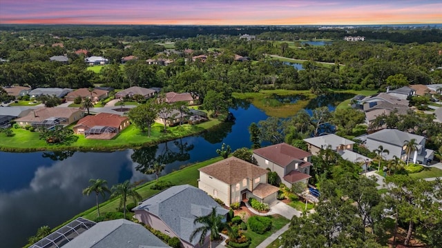 9528 Knightsbridge Cir, Sarasota, FL 34238 - aerial view at dusk of a residential view and a water view