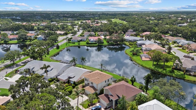 9528 Knightsbridge Cir, Sarasota, FL 34238 - aerial view of property and surrounding area with nearby suburban area and a large body of water