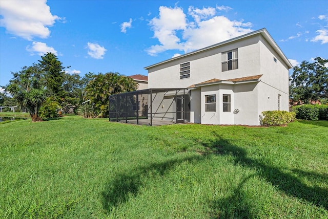 9528 Knightsbridge Cir, Sarasota, FL 34238 - rear view of house featuring stucco siding, a lawn, and a lanai