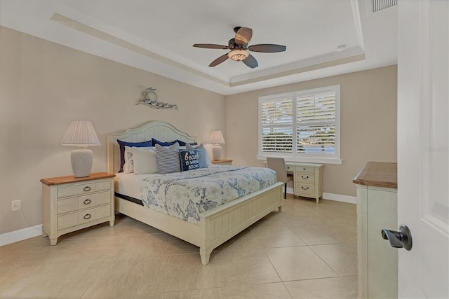 13334 Pacchio St, Venice, FL 34293 - bedroom with a raised ceiling, ceiling fan, and light tile patterned floors