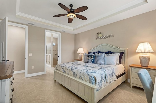 13334 Pacchio St, Venice, FL 34293 - bedroom with a raised ceiling, ornamental molding, a ceiling fan, and connected bathroom