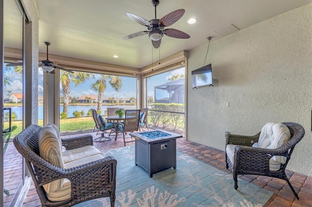 13334 Pacchio St, Venice, FL 34293 - sunroom with a textured wall, ceiling fan, a fire pit, outdoor dining space, and recessed lighting