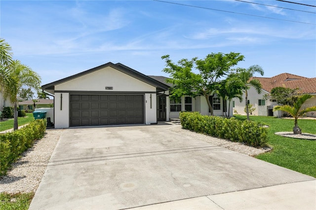26115 Rampart Blvd, Punta Gorda, FL 33983 - ranch-style house featuring stucco siding, concrete driveway, a garage, and a front lawn