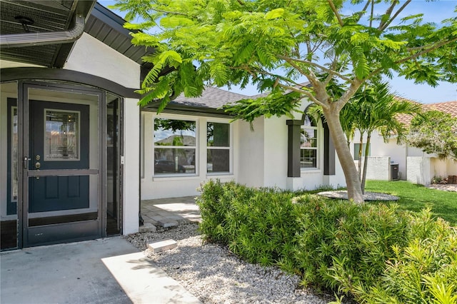 26115 Rampart Blvd, Punta Gorda, FL 33983 - doorway to property with stucco siding