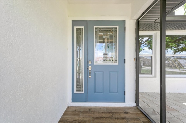 26115 Rampart Blvd, Punta Gorda, FL 33983 - doorway to property featuring stucco siding