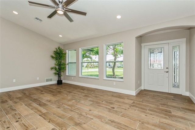 26115 Rampart Blvd, Punta Gorda, FL 33983 - foyer featuring arched walkways, a ceiling fan, light wood-type flooring, recessed lighting, and vaulted ceiling