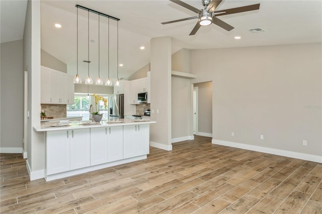 26115 Rampart Blvd, Punta Gorda, FL 33983 - kitchen featuring appliances with stainless steel finishes, light countertops, ceiling fan, white cabinetry, and recessed lighting