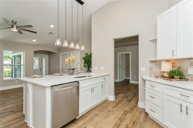 26115 Rampart Blvd, Punta Gorda, FL 33983 - kitchen featuring dishwasher, a peninsula, ceiling fan, light countertops, and light wood-style floors