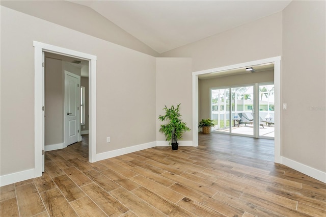 26115 Rampart Blvd, Punta Gorda, FL 33983 - spare room featuring lofted ceiling and light wood-type flooring