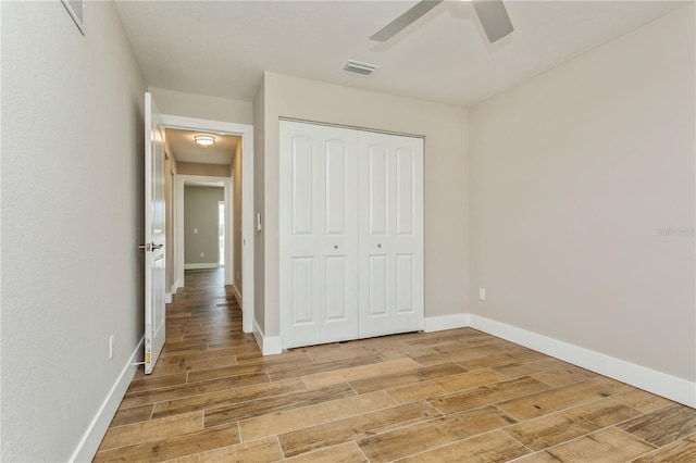 26115 Rampart Blvd, Punta Gorda, FL 33983 - unfurnished bedroom featuring light wood finished floors, a closet, and ceiling fan