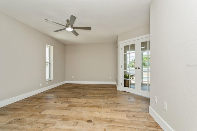 26115 Rampart Blvd, Punta Gorda, FL 33983 - empty room with french doors, a ceiling fan, and light wood finished floors