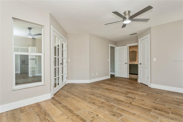26115 Rampart Blvd, Punta Gorda, FL 33983 - empty room featuring a ceiling fan and light wood-style floors