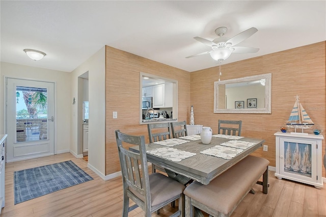 330 Mission Trl N Unit F, Venice, FL 34285 - dining space featuring light wood finished floors and a ceiling fan