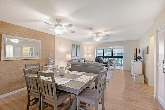330 Mission Trl N Unit F, Venice, FL 34285 - dining room with light wood finished floors and a ceiling fan