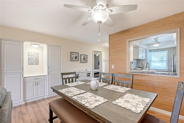 330 Mission Trl N Unit F, Venice, FL 34285 - dining room featuring a ceiling fan and light wood-style floors