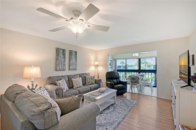 330 Mission Trl N Unit F, Venice, FL 34285 - living area with light wood-style flooring and a ceiling fan