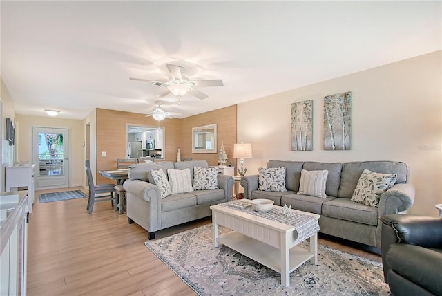 330 Mission Trl N Unit F, Venice, FL 34285 - living area featuring ceiling fan and light wood finished floors
