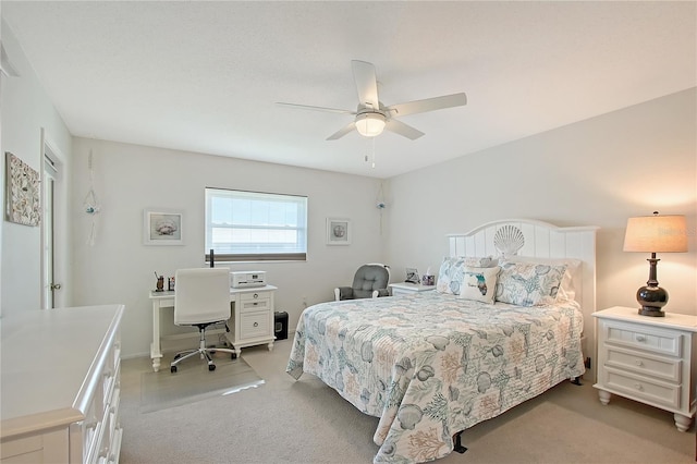 330 Mission Trl N Unit F, Venice, FL 34285 - bedroom featuring light carpet, an office area, and a ceiling fan