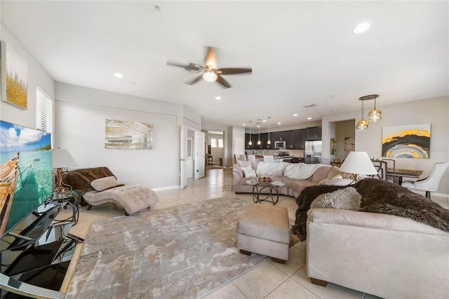 23527 Awabuki Unit 202, Venice, FL 34293 - living area with ceiling fan, healthy amount of natural light, light tile patterned floors, and recessed lighting